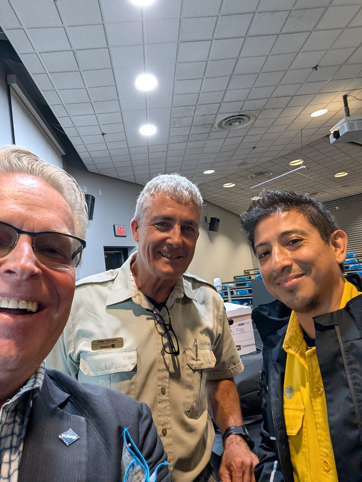 Peter Diedrich with two community members at a public meeting